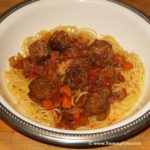 Bowl of Spaghetti and Meatballs, sauce and meatballs cooked in a Crock Pot and served over noodles.