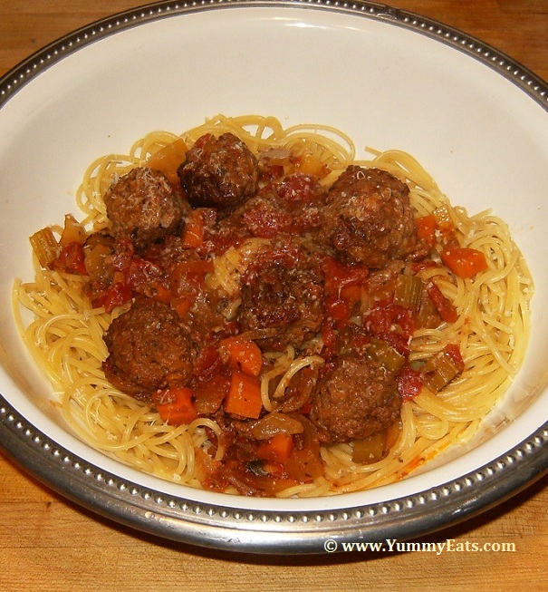 Bowl of Spaghetti and Meatballs, sauce and meatballs cooked in a Crock Pot and served over noodles.