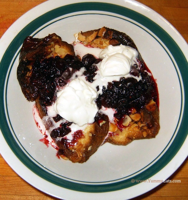 Pain Perdu with Cranberry-Currant Compote and topped with home whipped cream - Plated dessert.